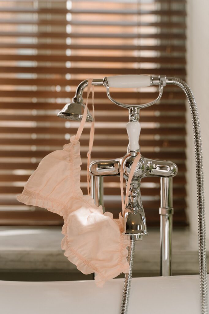 Improper drying of a bra hung by shoulder straps over a faucet
