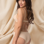 Model wearing nude seamless briefs with laser-cut edges for invisible coverage